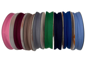 Set of colorful ribbons arranged in a circular pattern on a white background